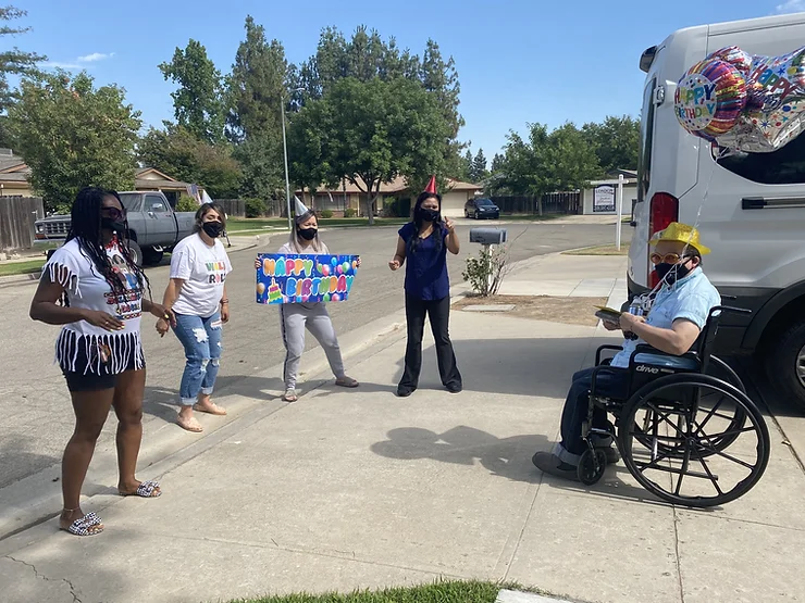 UCP staff Rhonda Hunter, Kristine Moreno, Kayana Moua and Sek Vann celebrate UCPCC student Felix's birthday.