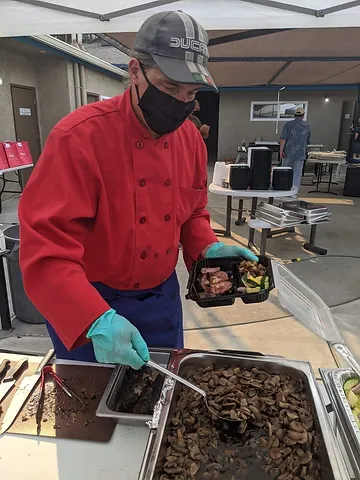 Chef Keith Allen puts the final touches on dinner.