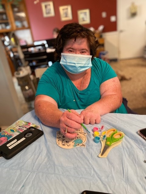 Student Lori completes her art project at home.